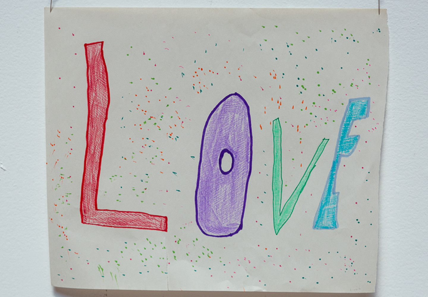 A drawn sign saying 'Love'